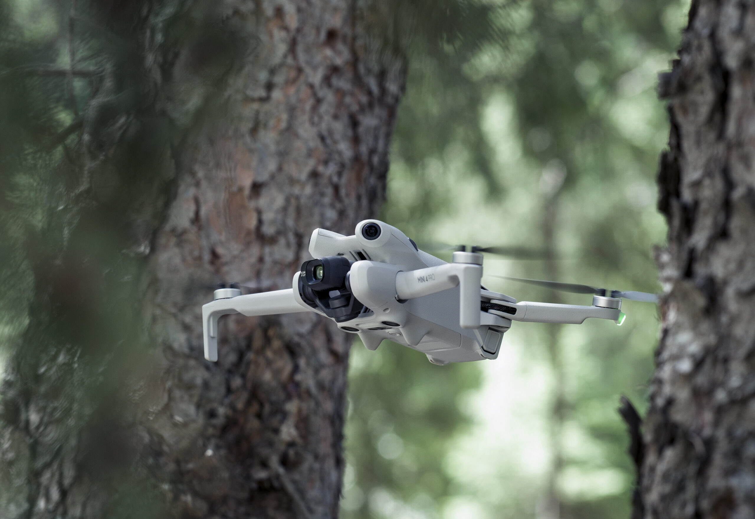 DJI Mini 4 Pro shown during an obstacle avoidance demonstration.